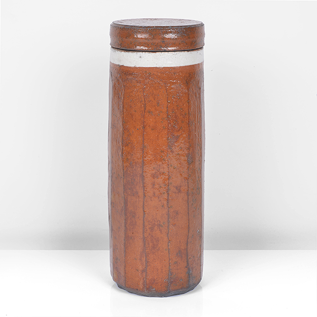 An orange raku tall lidded vessel made by Inger Rokkjaer in 2005 sold at auction by Maak Contemporary Ceramics