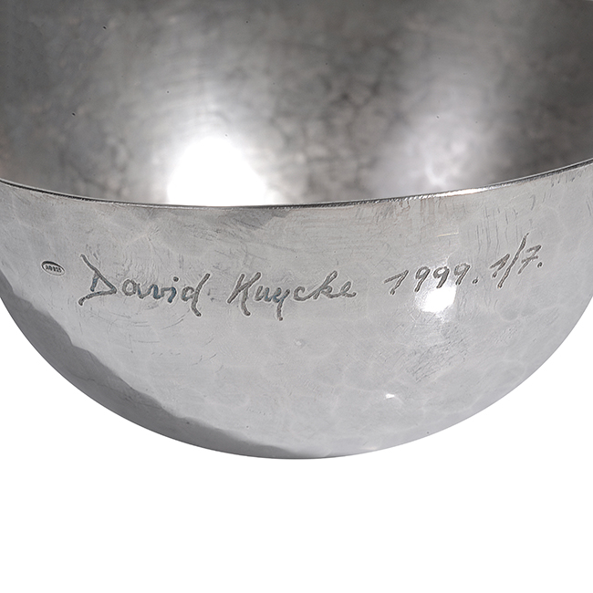 An incised signature and date on a silver bowl made by David Huycke