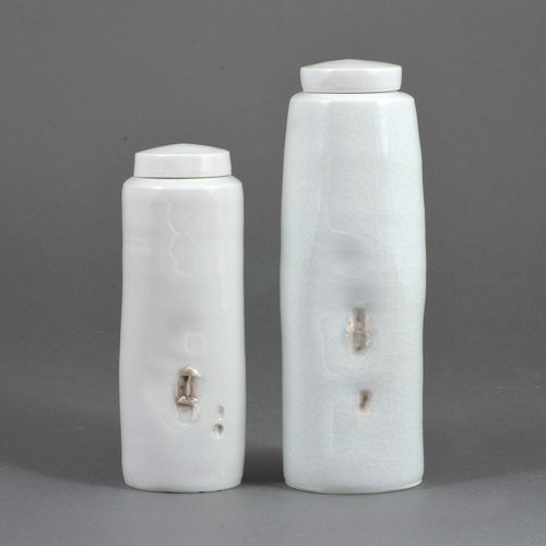 Two pale blue celadon porcelain 'cargo' vessels made by Edmund de Waal in circa 2000 sold at auction by Maak Contemporary Ceramics