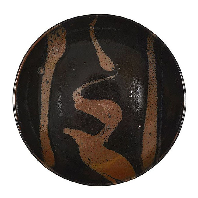 A tenmoku stoneware dish made by Hamada Shoji sold at auction by Maak Contemporary Ceramics