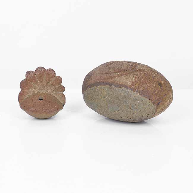 A brown stoneware 'Lucky Tatty' and miniature rattle made by Ian Godfrey sold at auction by Maak Contemporary Ceramics