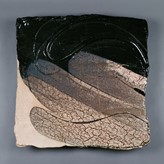 A black stoneware platter made by Claude Champy in 1989 sold at auction by Maak Contemporary Ceramics