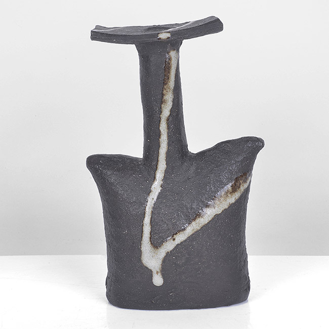 A dark brown stoneware bottle vase made by Janet Leach in circa 1990 sold at auction by Maak Contemporary Ceramics