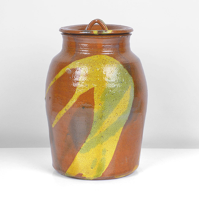 An amber and yellow stoneware lidded jar made by Betty Woodman sold at auction by Maak Contemporary Ceramics