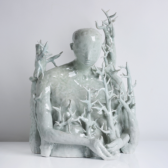 A celadon porcelain 'Figure in Branches' made by Claire Curneen in 2006 sold at auction by Maak Contemporary Ceramics