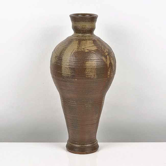 A brown stoneware vessel made by R J Washington in 1981 sold at auction by Maak Contemporary Ceramics