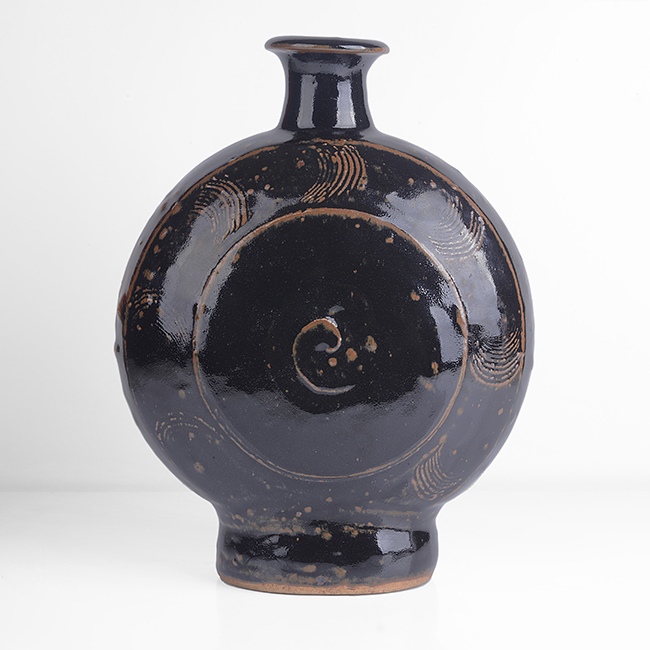 A tenmoku stoneware pilgrim bottle made by Bernard Leach in circa 1960 sold at auction by Maak Contemporary Ceramics