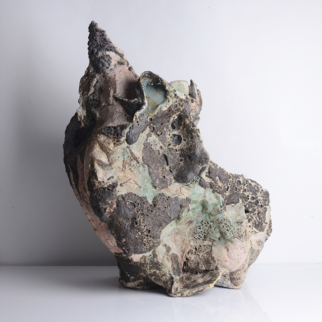 A brown, pink, green and blue mixed laminated clay sculptural form made by Ewen Henderson in 1988 sold at auction by Maak Contemporary Ceramics