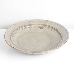 A green stoneware open bowl made by Richard Batterham sold at auction by Maak Contemporary Ceramics