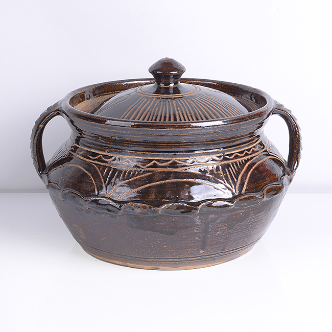 A brown stoneware casserole made by Michael Cardew in circa 1975 sold at auction by Maak Contemporary Ceramics