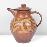 An amber earthenware coffee pot made by Michael Cardew in circa 1932 sold at auction by Maak Contemporary Ceramics