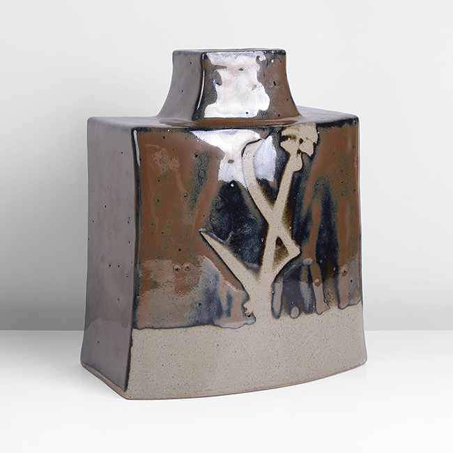 A persimmon stoneware curved bottle made by Hamada Shoji sold at auction by Maak Contemporary Ceramics
