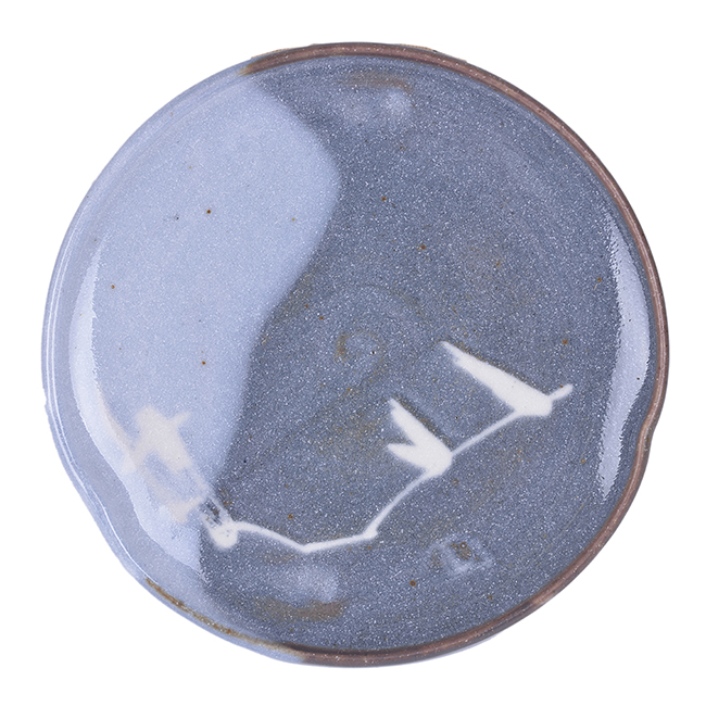 A Shino plate made by Sakai Kobu sold at auction by Maak