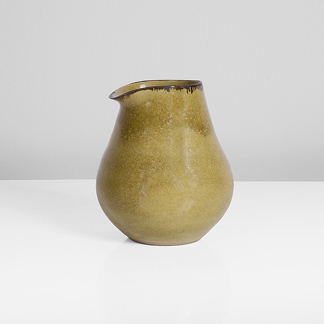 A yellow stoneware pourer made by Lucie Rie in circa 1988 sold at auction by Maak Contemporary Ceramics