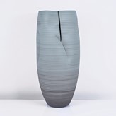 A blue earthenware tall slashed vessel made by Nicholas Arroyave-Portela sold at auction by Maak Contemporary Ceramics