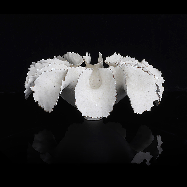 A white stoneware ruffle form made by Ursula Morley-Price in 1982 sold at auction by Maak Contemporary Ceramics