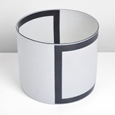 A white and black porcelain cylinder made by Bodil Manz sold at auction by Maak Contemporary Ceramics