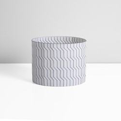 A porcelain black and white vessel made by Bodil Manz