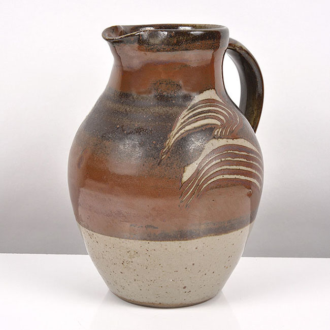 An iron glaze stoneware jug made by Geoffrey Whiting in circa 1970 sold at auction by Maak Contemporary Ceramics