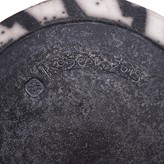 An impressed maker's mark and incised signature on date on a black and white raku vessel made by David Roberts in 2015 sold at auction by Maak Contemporary Ceramics