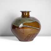 A brown and green stoneware vase made by Japanese artist Ichino Shigeyoshi sold at auction by Maak