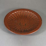 A brown stoneware dish made by Helen Pincombe sold at auction by Maak Contemporary Ceramics
