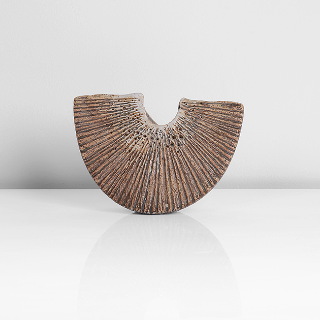 A mottled brown stoneware crescent form made by Alan Wallwork sold at auction by Maak Contemporary Ceramics