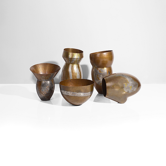 Five copper and white metal asymmetric vessels made by Pete Stevens in 2000