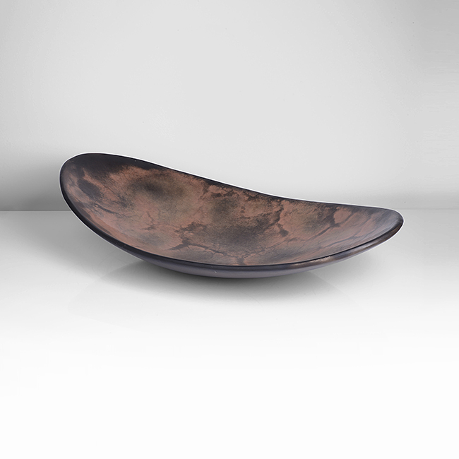 A terracotta burnished and smoke fired earthenware dish made by Gabriele Koch in 2000 sold at auction by Maak Contemporary Ceramics