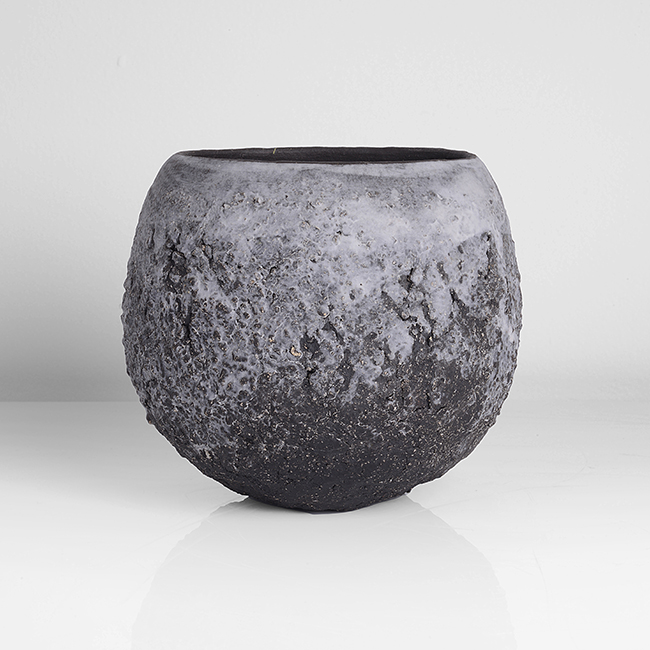 A black stoneware bowl with white porcelain slips made by Gabriele Koch in 2012 sold at auction by Maak Contemporary Ceramics