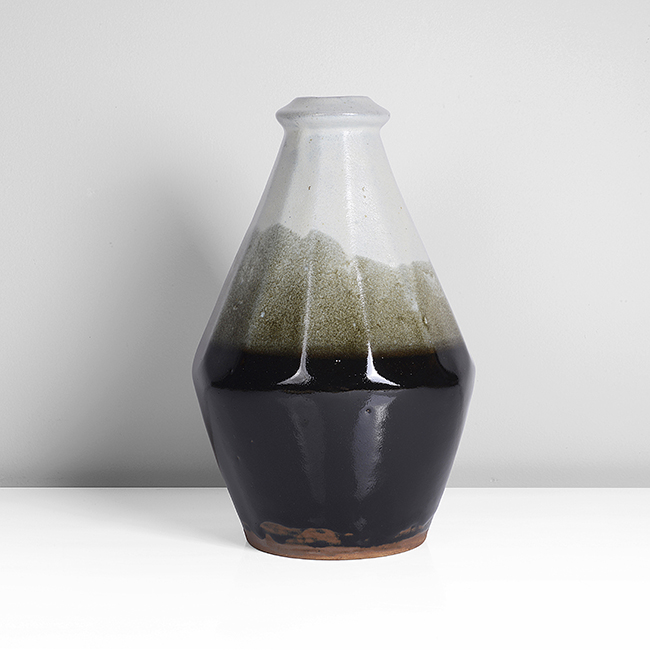 A tenmoku and nuka stoneware faceted bottle vase made by Hamada Shinsaku sold at auction by Maak