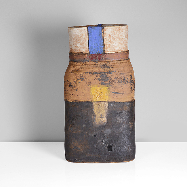 A black and orange stoneware flattened vessel made by Robin Welch sold at auction by Maak Contemporary Ceramics