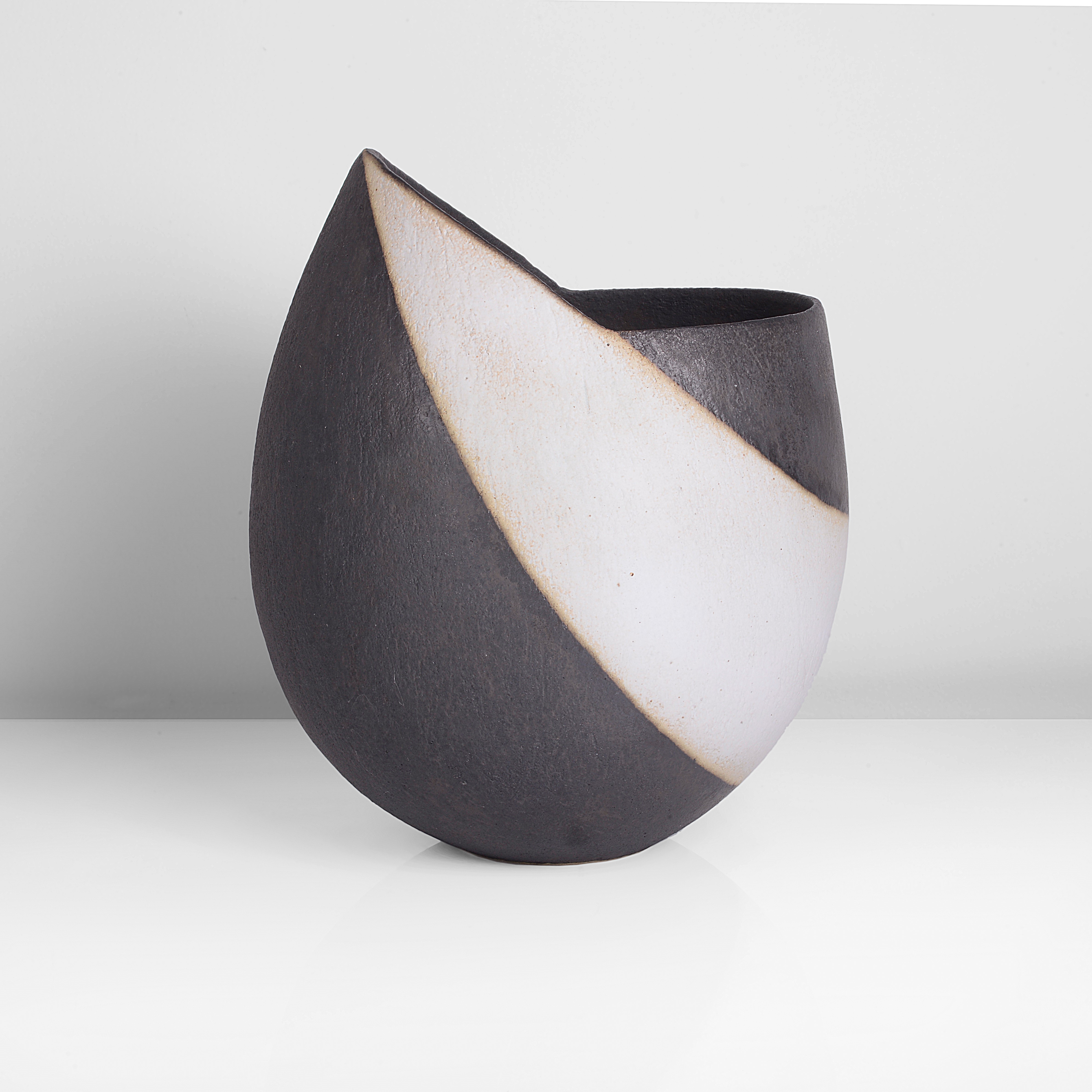 A black and white stoneware vessel made by John Ward in circa 1990 sold at auction by Maak Contemporary Ceramics
