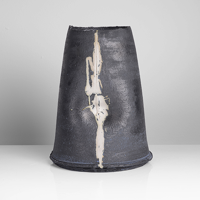 A black stoneware tapered vessel made by Dan Kelly in circa 2002 sold at auction by Maak Contemporary Ceramics