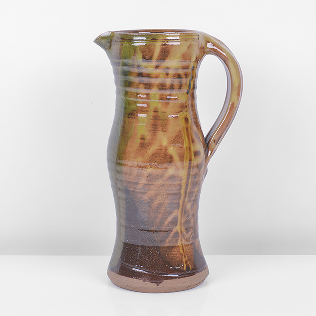 An amber earthenware jug made by Clive Bowen sold at auction by Maak Contemporary Ceramics