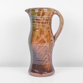 An amber earthenware jug made by Clive Bowen sold at auction by Maak Contemporary Ceramics