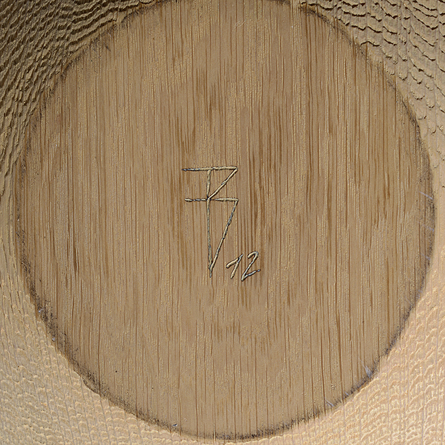 An incised signature on a wood vessel made by Friedemann Buehler