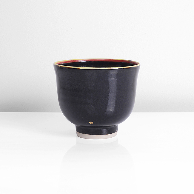 A black porcelain teabowl made by Emmanuel Cooper in circa 2010 sold at auction by Maak Contemporary Ceramics
