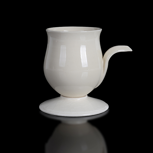 A white earthenware cup on stand made by Magdalene Odundo sold at auction by Maak Contemporary Ceramics