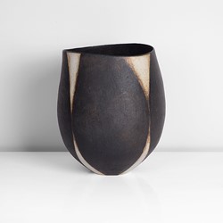 A black and white stoneware asymmetric vessel made by John Ward