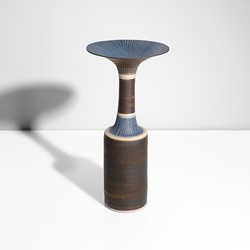 A manganese and blue stoneware vase made by Lucie Rie