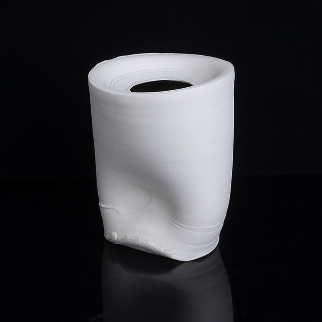 A white porcelain vessel made by Dan Kelly in 2003 sold at auction by Maak Contemporary Ceramics