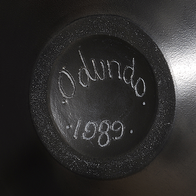 An incised signature and date on a vase made by Magdalene Odundo