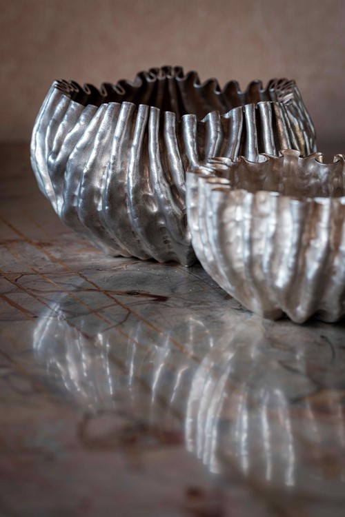 Two silver 'furl forms' made by Clare Ransom