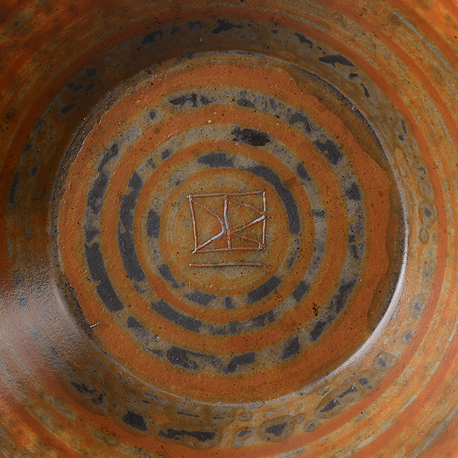 An incised DR mark on an orange earthenware bowl made by David Roberts sold at auction by Maak Contemporary Ceramics